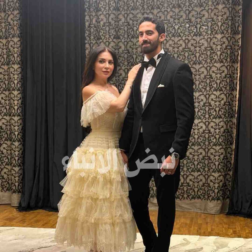 مي عز الدين وزوجها